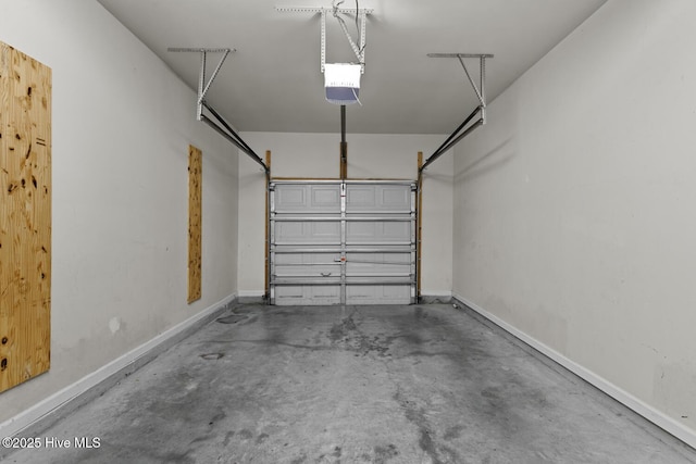 231 Glenhaven Ln, Jacksonville, NC 28546 - garage featuring a garage door opener and baseboards