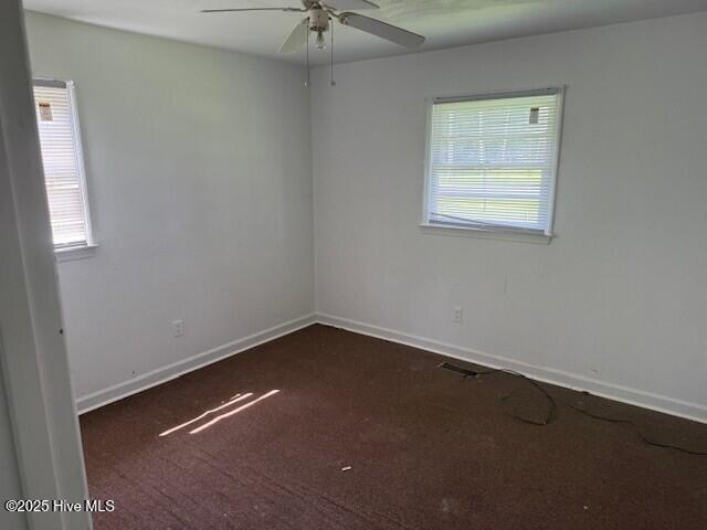 513 Hall Siding Rd, Ahoskie, NC 27910 - carpeted spare room with a ceiling fan and baseboards