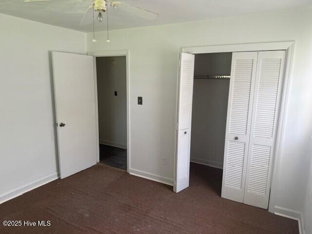 513 Hall Siding Rd, Ahoskie, NC 27910 - unfurnished bedroom with carpet, a closet, and ceiling fan