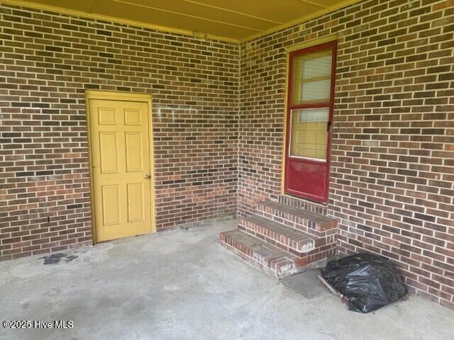 513 Hall Siding Rd, Ahoskie, NC 27910 - property entrance featuring a patio and brick siding