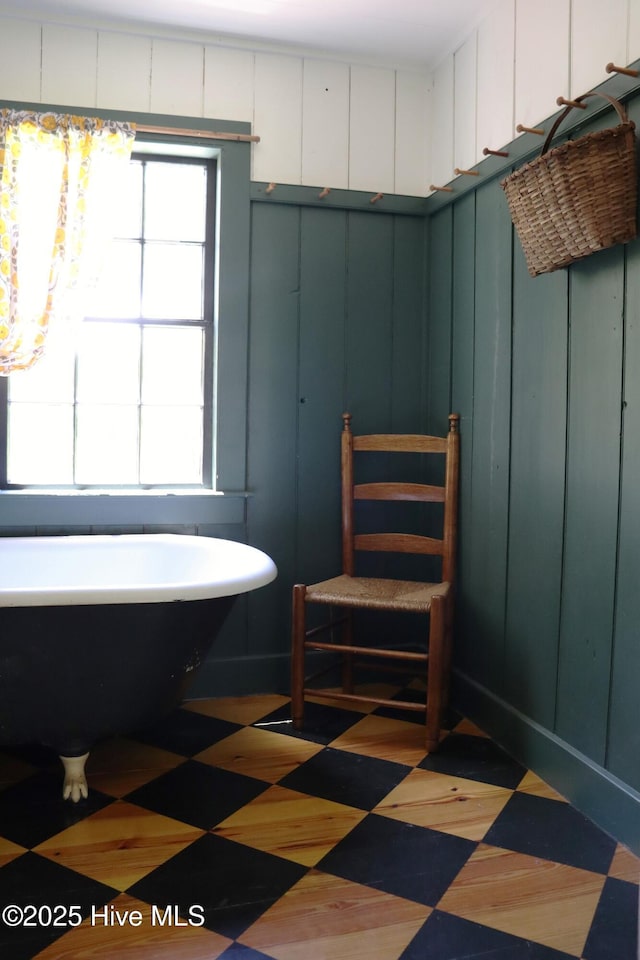 212 Carteret St, Bath, NC 27808 - full bathroom with a freestanding tub, a chandelier, and a decorative wall