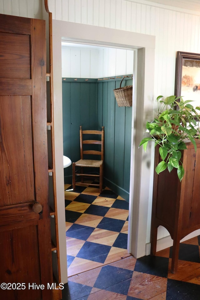 212 Carteret St, Bath, NC 27808 - bedroom with tile patterned floors and wood walls