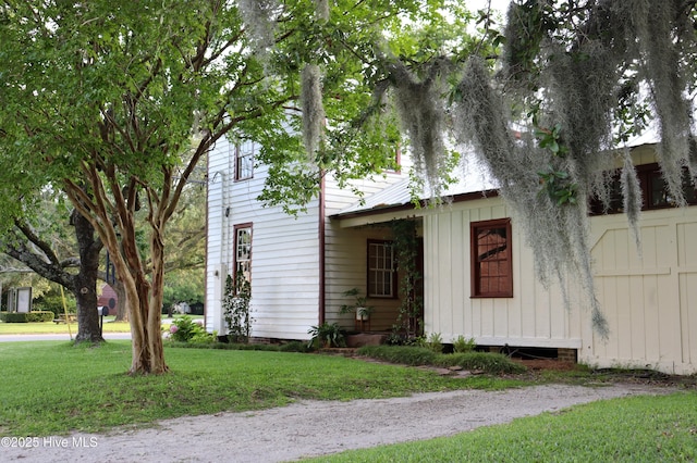 212 Carteret St, Bath, NC 27808 - view of side of property featuring a lawn and board and batten siding