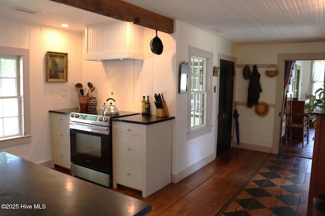 212 Carteret St, Bath, NC 27808 - kitchen with stainless steel electric stove, dark countertops, white cabinetry, and dark wood-style floors