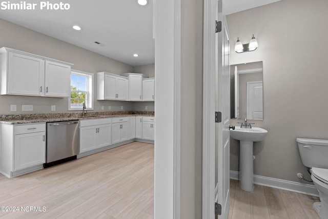 770 Aria Ln, Hubert, NC 28539 - kitchen with dishwasher, white cabinetry, light stone counters, light wood-type flooring, and recessed lighting