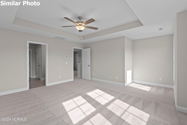 770 Aria Ln, Hubert, NC 28539 - unfurnished bedroom with a raised ceiling and light colored carpet