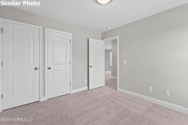 770 Aria Ln, Hubert, NC 28539 - unfurnished bedroom with carpet flooring and baseboards