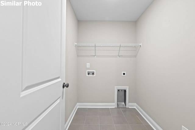 770 Aria Ln, Hubert, NC 28539 - laundry area with electric dryer hookup, washer hookup, and tile patterned floors