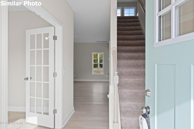 770 Aria Ln, Hubert, NC 28539 - foyer featuring wood finished floors and stairs
