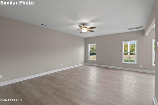 770 Aria Ln, Hubert, NC 28539 - unfurnished room featuring ceiling fan, healthy amount of natural light, and wood finished floors
