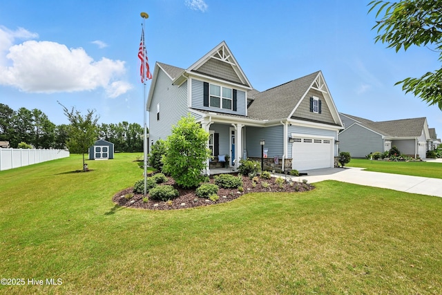 129 Glenmoor Path, Moyock, NC 27958 - view of front of house with a porch, concrete driveway, a shed, and a shingled roof