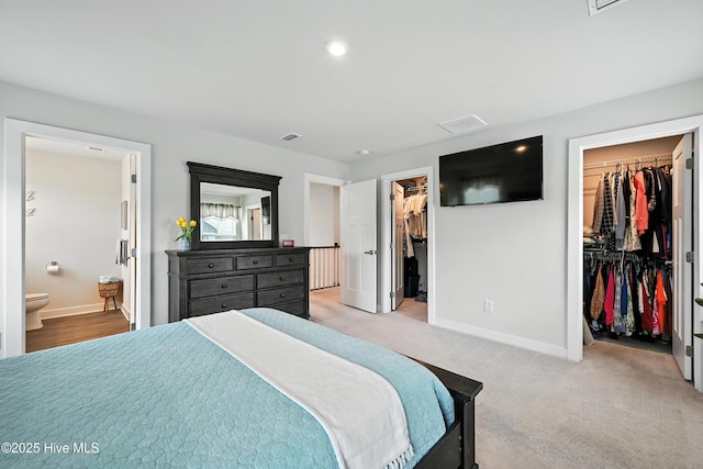 129 Glenmoor Path, Moyock, NC 27958 - bedroom with a walk in closet, ensuite bath, a closet, and recessed lighting