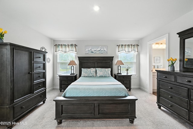 129 Glenmoor Path, Moyock, NC 27958 - bedroom featuring light carpet, multiple windows, and connected bathroom