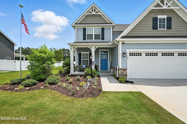 129 Glenmoor Path, Moyock, NC 27958 - craftsman-style home with a porch, concrete driveway, stone siding, an attached garage, and a shingled roof