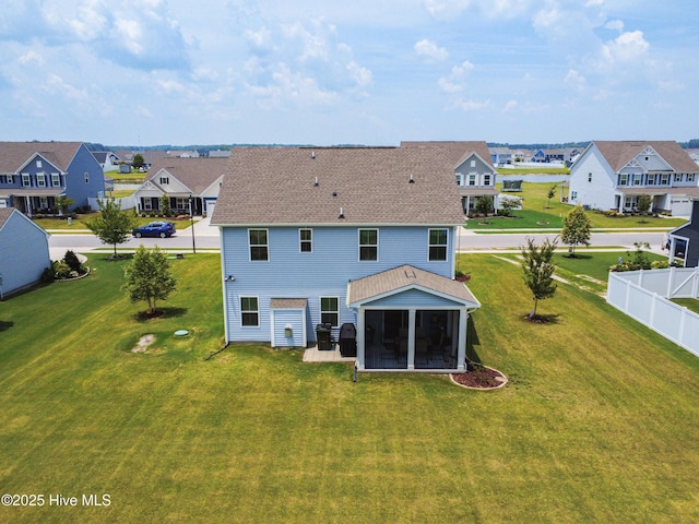 129 Glenmoor Path, Moyock, NC 27958 - back of house with a residential view, a sunroom, and roof with shingles