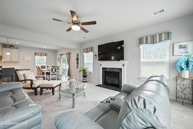 129 Glenmoor Path, Moyock, NC 27958 - living area featuring a ceiling fan, light colored carpet, healthy amount of natural light, and recessed lighting