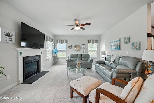 129 Glenmoor Path, Moyock, NC 27958 - living area with ceiling fan, carpet flooring, and a fireplace with flush hearth
