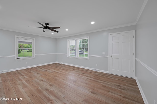 2704 Forrest Dr, Kinston, NC 28504 - empty room featuring ceiling fan, ornamental molding, plenty of natural light, wood finished floors, and recessed lighting