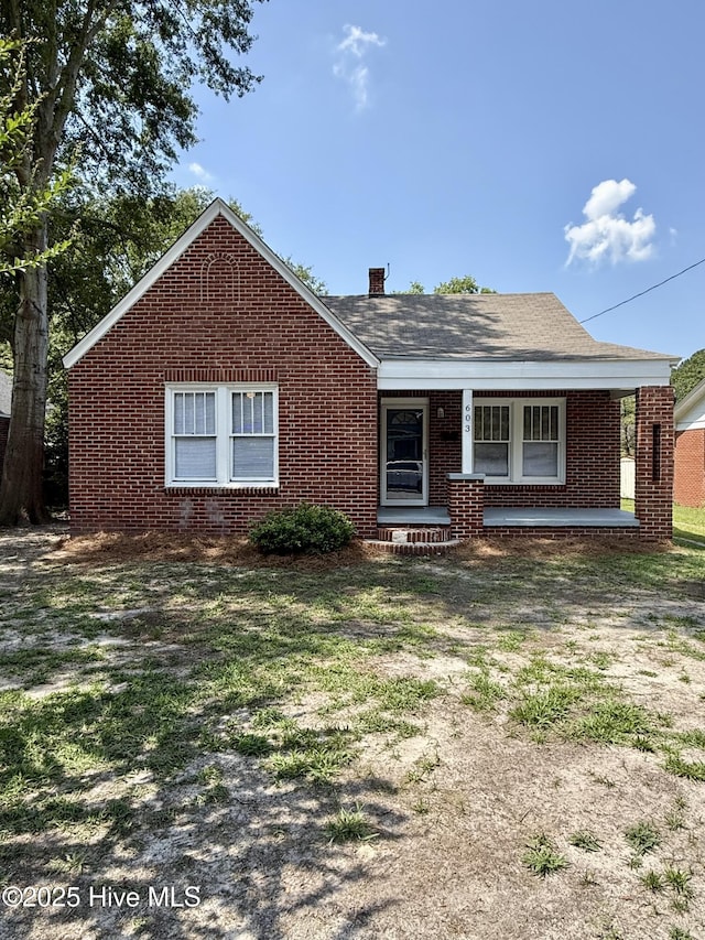 603 E 8th St, Washington, NC 27889 - view of front of property featuring brick siding and covered porch