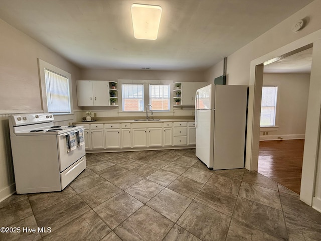 603 E 8th St, Washington, NC 27889 - kitchen featuring white appliances, open shelves, white cabinetry, and light countertops