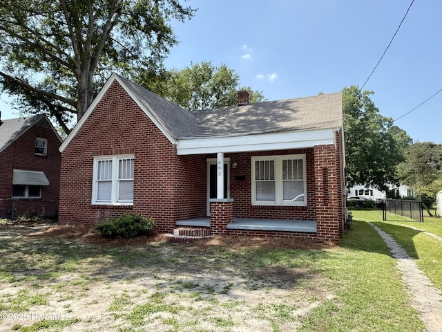 603 E 8th St, Washington, NC 27889 - bungalow-style home featuring a porch, brick siding, and a chimney