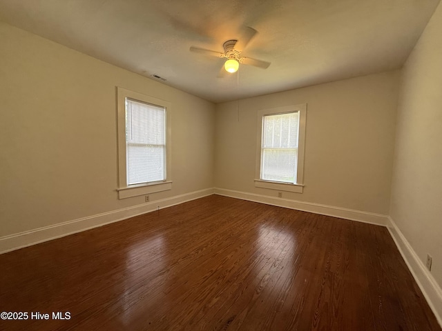 603 E 8th St, Washington, NC 27889 - spare room with dark wood finished floors and a ceiling fan