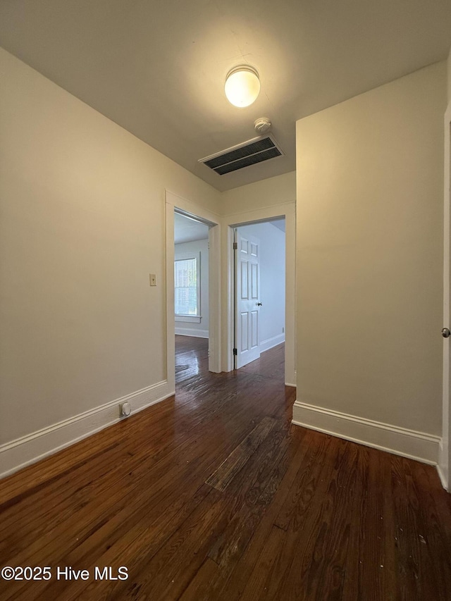 603 E 8th St, Washington, NC 27889 - empty room with dark wood-type flooring and baseboards