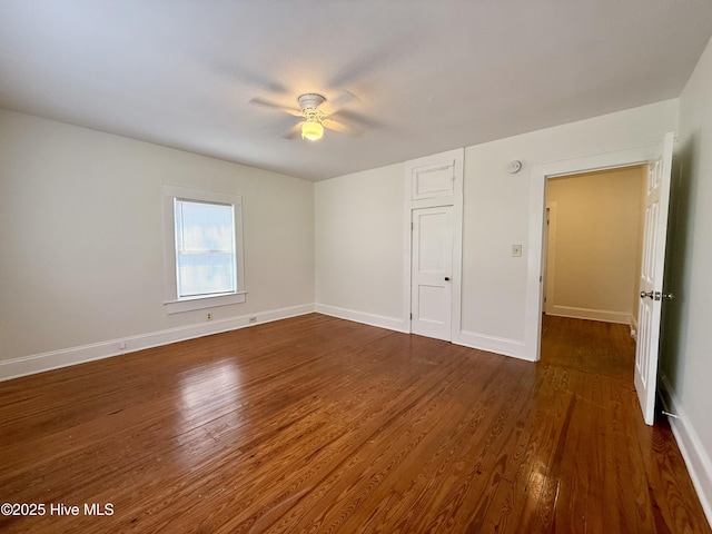603 E 8th St, Washington, NC 27889 - unfurnished bedroom with dark wood-style flooring and ceiling fan