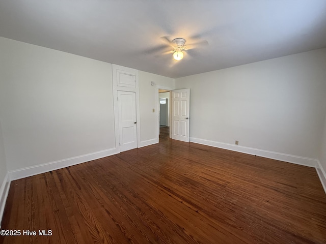 603 E 8th St, Washington, NC 27889 - unfurnished bedroom with dark wood-type flooring and a ceiling fan