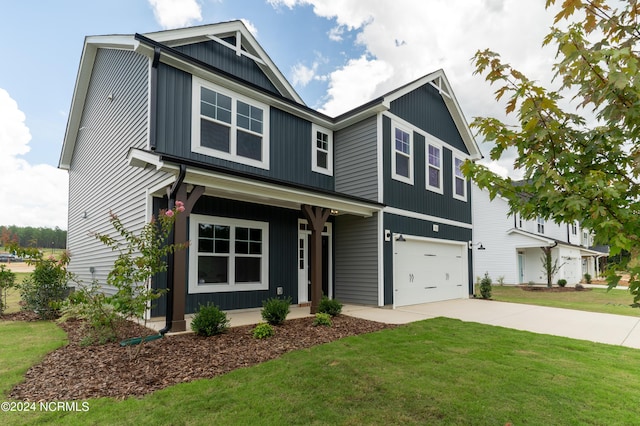 301 Glassmine Trl Unit 48, Aberdeen, NC 28315 - view of front of house featuring concrete driveway, an attached garage, a front yard, and board and batten siding