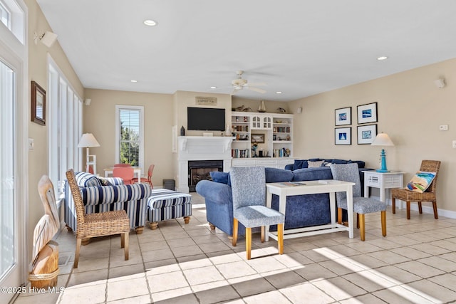 9711 Dolphin Ridge Rd, Emerald Isle, NC 28594 - living area featuring ceiling fan, recessed lighting, light tile patterned flooring, and a fireplace