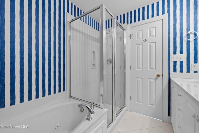 9711 Dolphin Ridge Rd, Emerald Isle, NC 28594 - full bath featuring wallpapered walls, a shower stall, tile patterned flooring, a whirlpool tub, and vanity