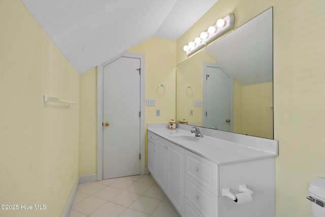 9711 Dolphin Ridge Rd, Emerald Isle, NC 28594 - bathroom with lofted ceiling, vanity, and tile patterned flooring