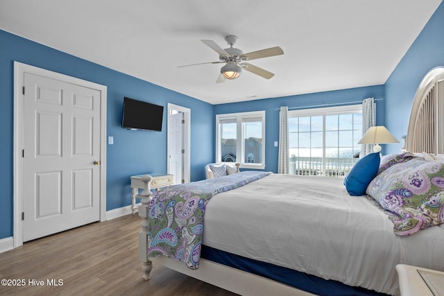 9711 Dolphin Ridge Rd, Emerald Isle, NC 28594 - bedroom with wood finished floors and a ceiling fan
