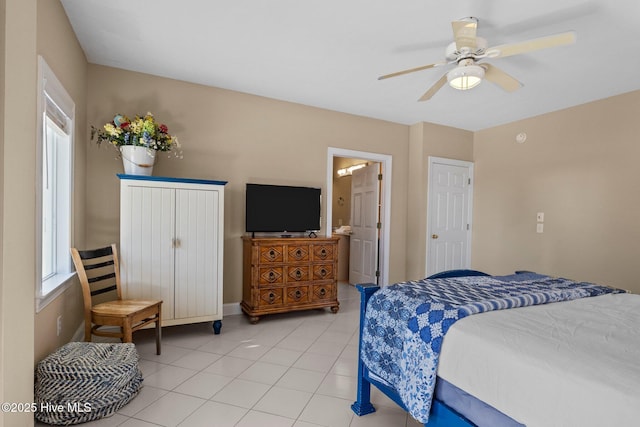 9711 Dolphin Ridge Rd, Emerald Isle, NC 28594 - bedroom featuring light tile patterned flooring, a ceiling fan, and ensuite bath