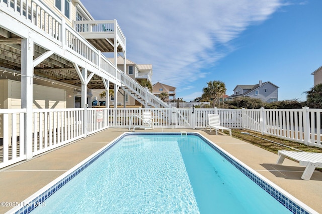 9711 Dolphin Ridge Rd, Emerald Isle, NC 28594 - view of pool with a patio, stairs, and a fenced backyard