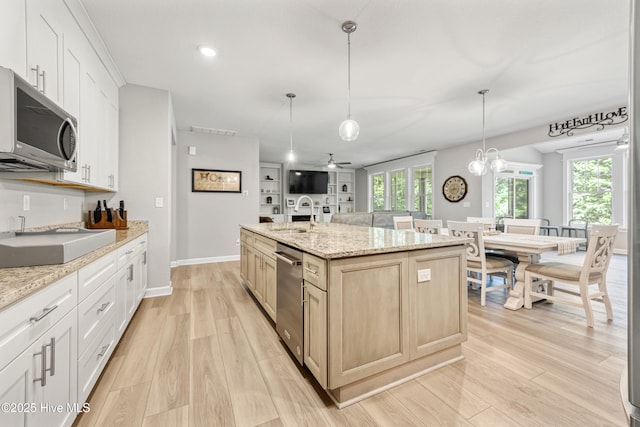 145 Beechnut Ave, South Mills, NC 27976 - kitchen with stainless steel appliances, light wood-style floors, a center island with sink, decorative light fixtures, and recessed lighting