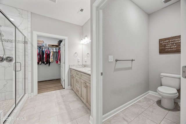145 Beechnut Ave, South Mills, NC 27976 - bathroom featuring vanity, a shower stall, a spacious closet, and marble finish floors