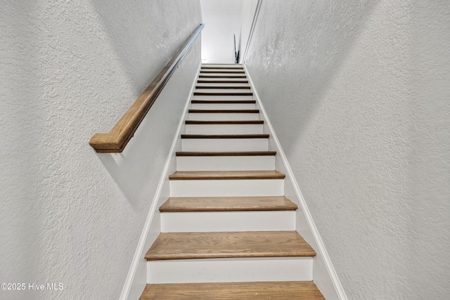 145 Beechnut Ave, South Mills, NC 27976 - staircase with a textured wall and wood finished floors