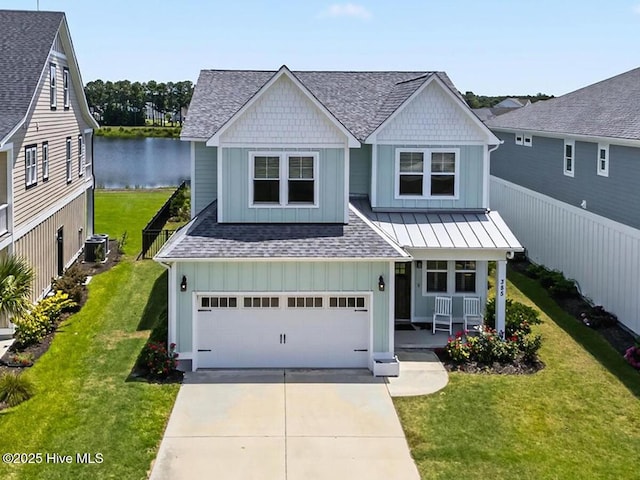 385 Summerhouse Dr, Holly Ridge, NC 28445 - view of front of home with board and batten siding, a porch, an attached garage, concrete driveway, and a shingled roof