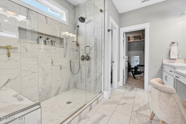 385 Summerhouse Dr, Holly Ridge, NC 28445 - bathroom featuring marble finish floors, a marble finish shower, vanity, and a spacious closet