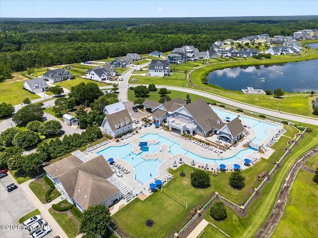 385 Summerhouse Dr, Holly Ridge, NC 28445 - aerial perspective of suburban area featuring a pool and a large body of water