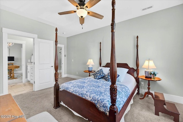 385 Summerhouse Dr, Holly Ridge, NC 28445 - carpeted bedroom with ensuite bathroom and a ceiling fan