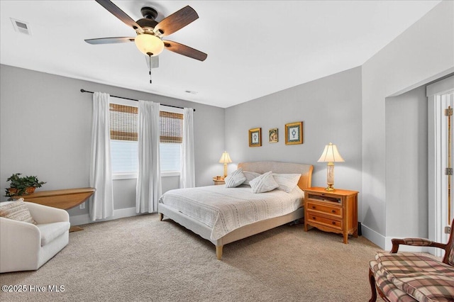 385 Summerhouse Dr, Holly Ridge, NC 28445 - carpeted bedroom with baseboards and a ceiling fan