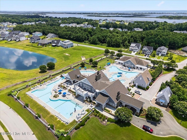 385 Summerhouse Dr, Holly Ridge, NC 28445 - bird's eye view of a pool area and a large body of water