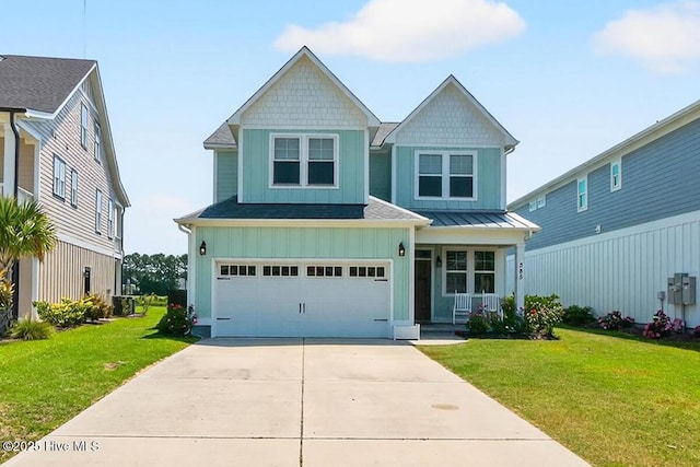 385 Summerhouse Dr, Holly Ridge, NC 28445 - view of front of house featuring driveway, a front yard, covered porch, an attached garage, and board and batten siding