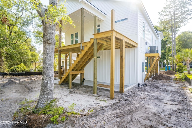 337 NE 48th St, Oak Island, NC 28465 - back of property featuring stairway and board and batten siding