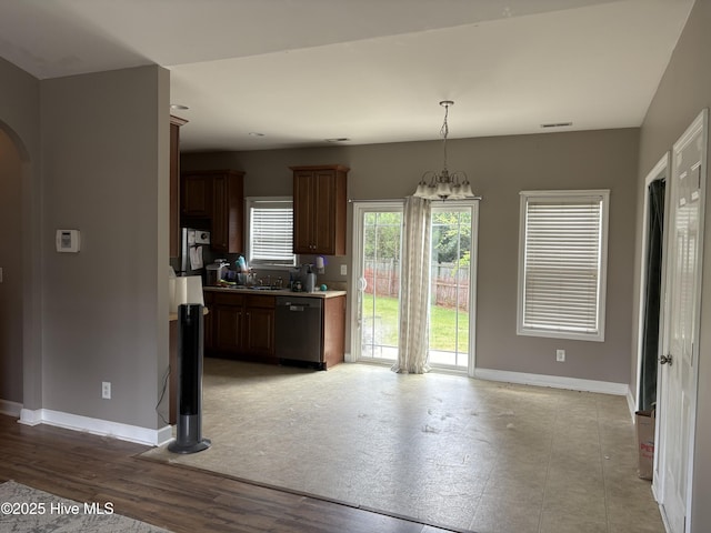 117 Boysenberry Fields Rd, Maple Hill, NC 28454 - kitchen featuring dishwasher, arched walkways, light countertops, pendant lighting, and a chandelier