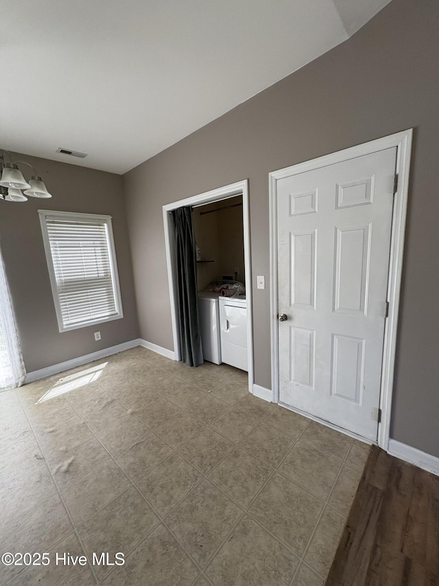 117 Boysenberry Fields Rd, Maple Hill, NC 28454 - unfurnished bedroom featuring washing machine and clothes dryer and tile patterned flooring