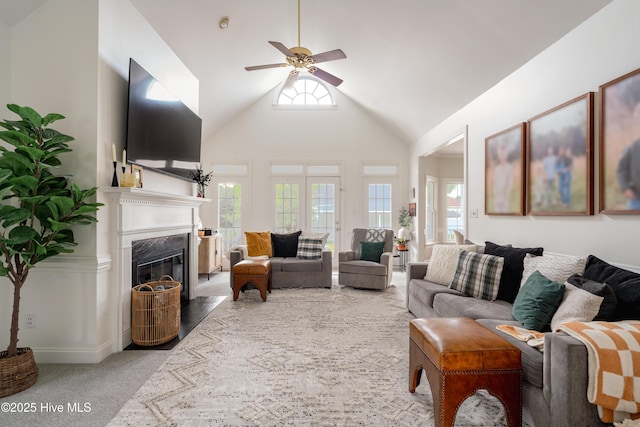 4409 Pinehurst Dr N, Wilson, NC 27896 - carpeted living area with a ceiling fan, high vaulted ceiling, and a premium fireplace